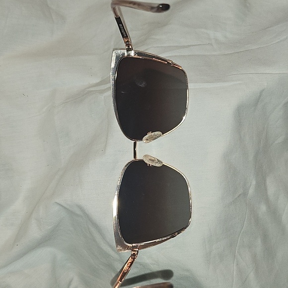 Stylish Pink and Black Sunglasses for a Bold Look - Picture 10 of 16